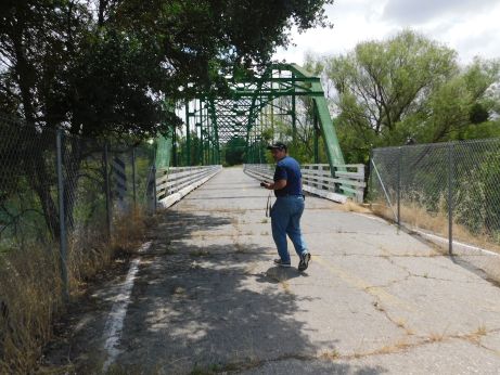 [Picture of some creep walking on bridge]